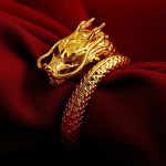 bague dragon en acier doré
